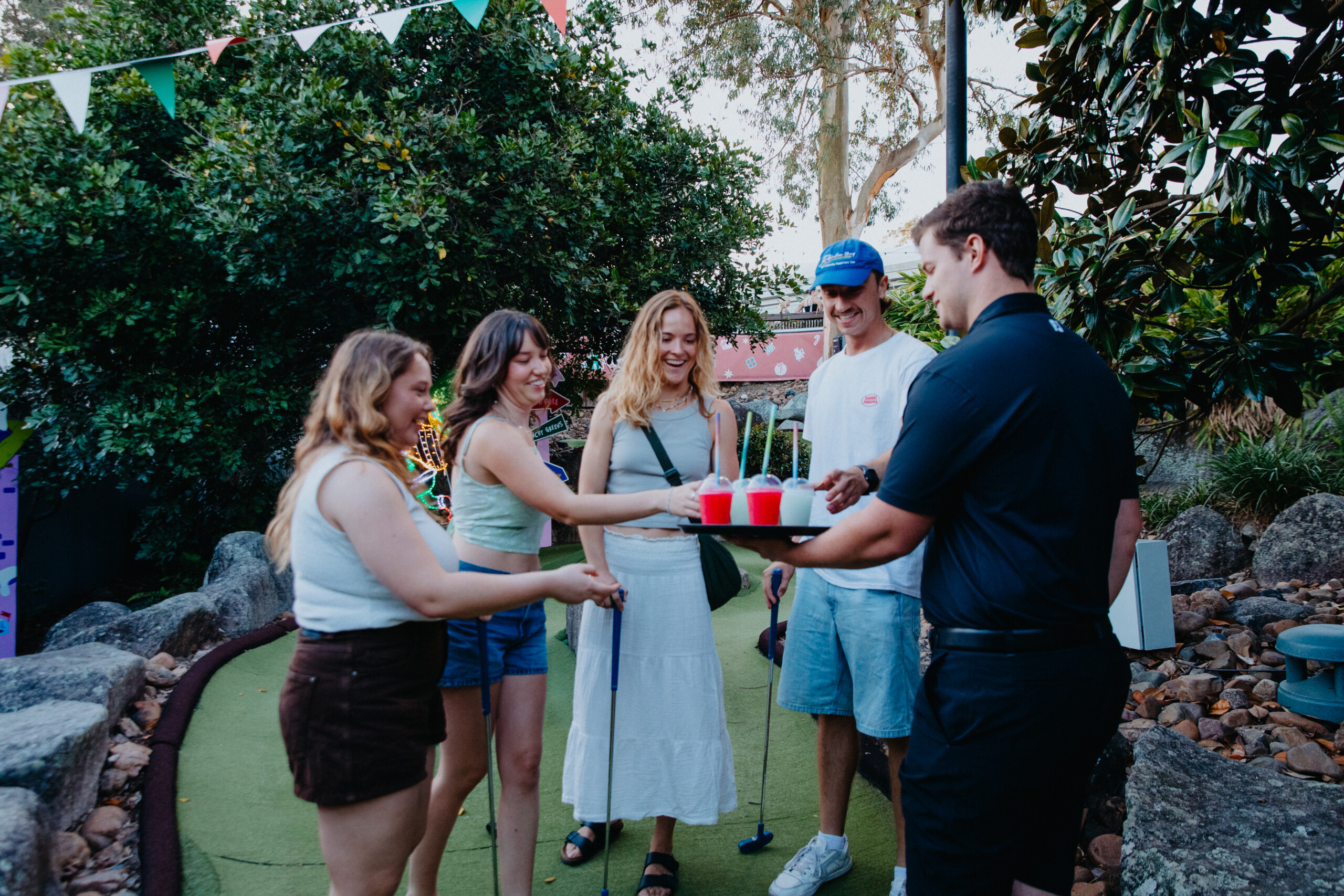 Drinks and snacks being delivered on Christmas Putt Putt course